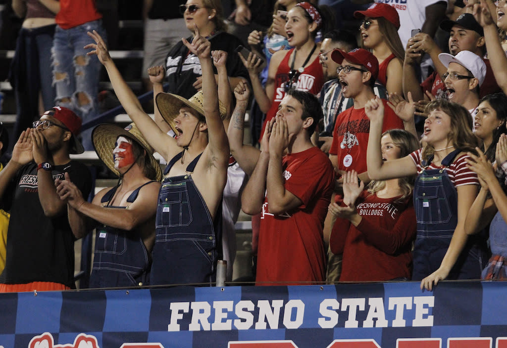 Students cheer at a Fresno State football game.