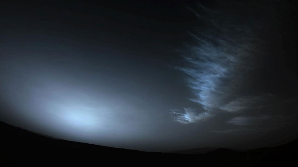  timelapse image of the sun peeking through clouds on mars with a lower, drifting cloud at right 