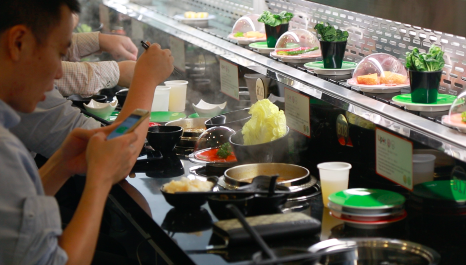 Customers dining at newly opened UPOT, an F&B brand from Taiwan. (Photo: Nurul Azliah/Yahoo Lifestyle Singapore)