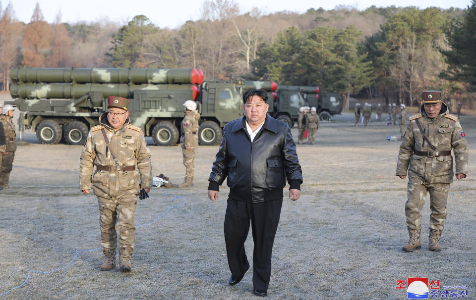 In this photo provided by the North Korean government, North Korean leader Kim Jong Un, center, supervises a live-fire drill of “super-large” multiple in North Korea Monday, March 18, 2024. Independent journalists were not given access to cover the event depicted in this image distributed by the North Korean government. The content of this image is as provided and cannot be independently verified. Korean language watermark on image as provided by source reads: "KCNA" which is the abbreviation for Korean Central News Agency. (Korean Central News Agency/Korea News Service via AP)