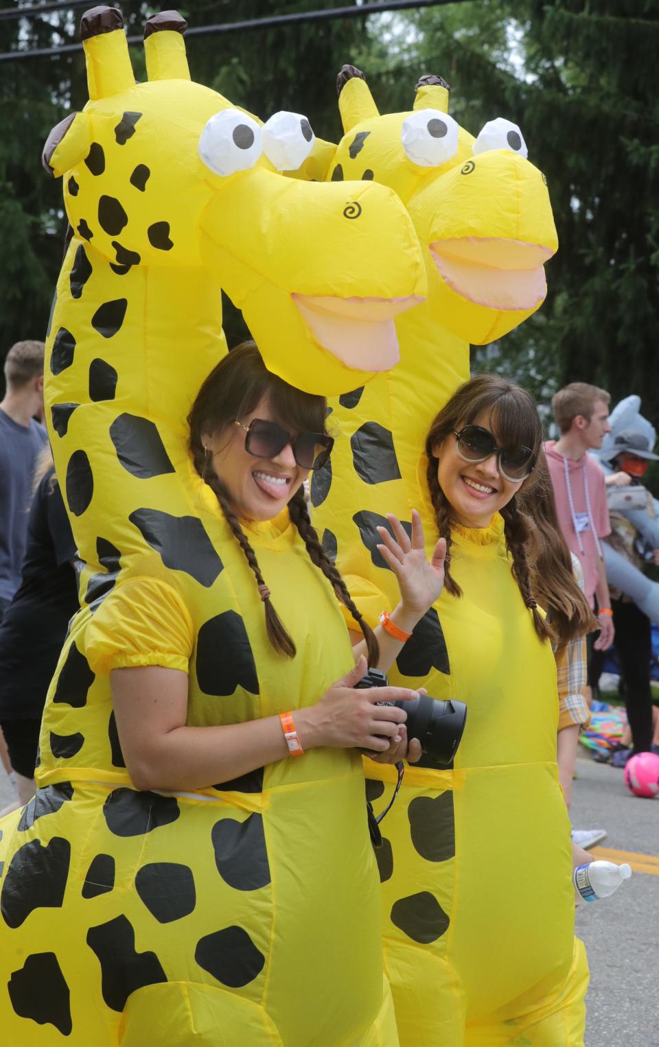 Danielle and Melissa, 37, of Toronto, Canada, walk in the Double Take Parade along Ravanna Rd. on Saturday, Aug. 6, 2022 in Twinsburg.