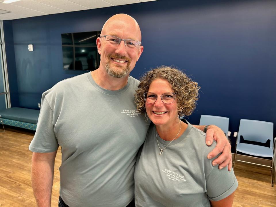 Bryan and his wife Stacy during Wednesday afternoon's press conference at the Holland Aquatic Center. Stacy was in charge of Bryan's nutrition as he attempted to swim across Lake Michigan last weekend.