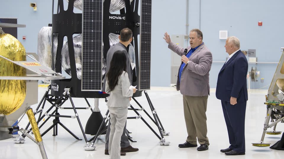 VP of Research and Development of Intuitive Machines, Tim Crain, second from right, speaks with former NASA science executive Thomas Zurbuchen, second from left, about the Nova-C lunar lander on May 31, 2019, at Goddard Space Flight Center in Maryland. - Aubrey Gemignani/NASA