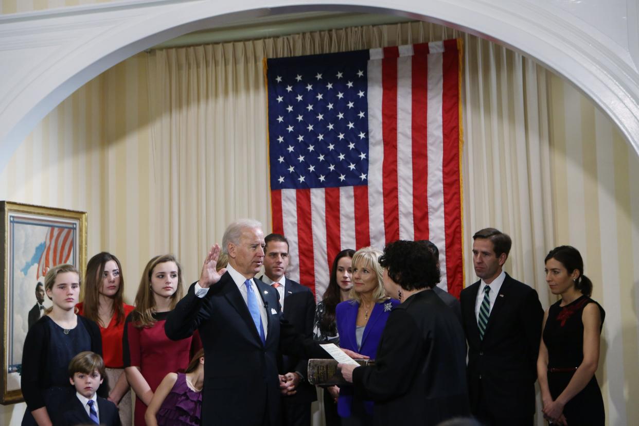 Biden takes the oath of office from Supreme Court Justice Sonia Sotomayor as his family looks on during the official swearing-in ceremony at the Naval Observatory on January 20, 2013, a day before the inauguration. 