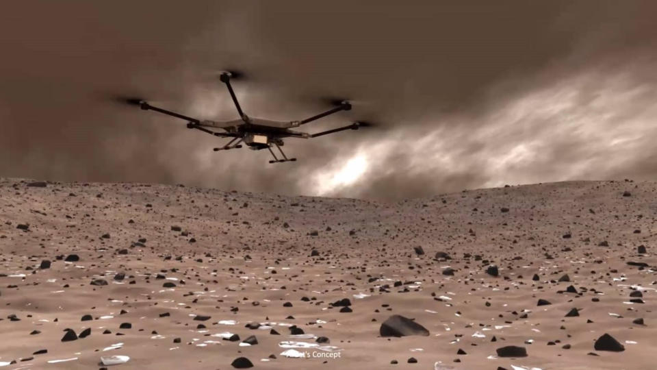 Απεικόνιση ενός μεγάλου drone που πετά πάνω από μια έρημη, βραχώδη επιφάνεια με έναν συννεφιασμένο ουρανό.