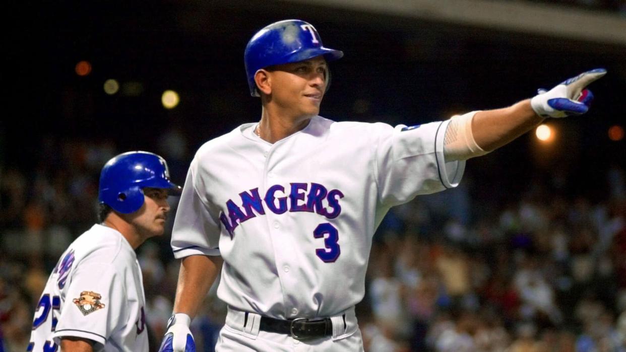 Mandatory Credit: Photo by Bill Janscha/AP/Shutterstock (6476255b)RODRIGUEZ PALMEIRO Texas Rangers' Alex Rodriguez, right, reacts after crossing home plate in front of teammate Rafael Palmeiro in the fifth inning against the Minnesota Twins, in Arlington, Texas.