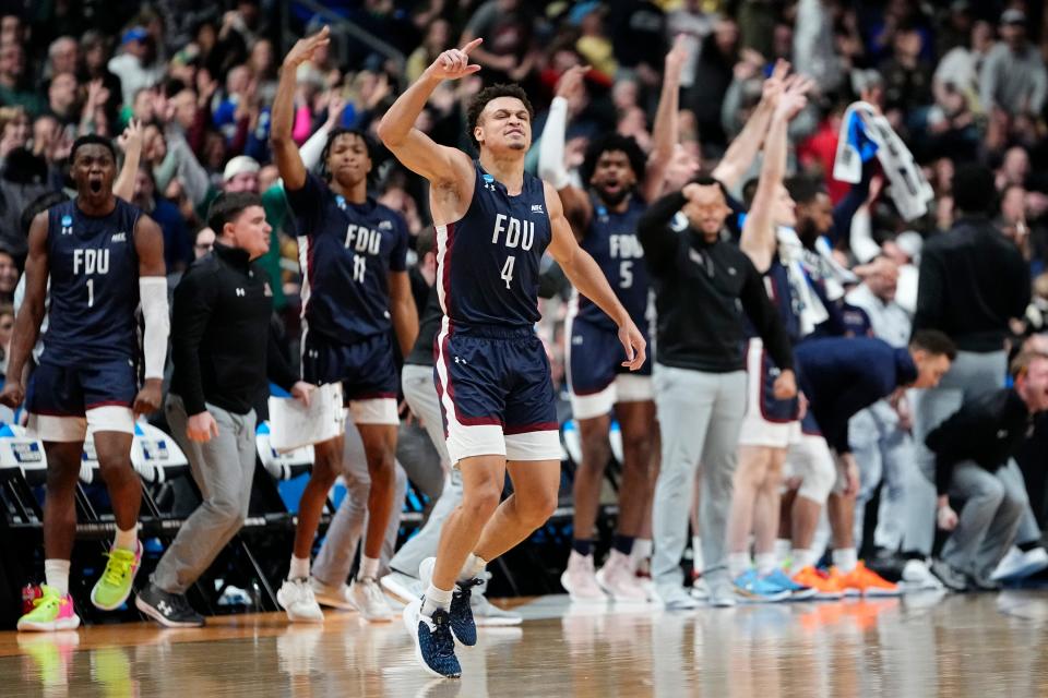 Mar 17, 2023; Columbus, Ohio, USA;  Fairleigh Dickinson Knights guard Grant Singleton (4) celebrates a three pointer during the first round of the NCAA men’s basketball tournament against the Purdue Boilermakers at Nationwide Arena. The Fairleigh Dickinson Knights won 63-58. Mandatory Credit: Adam Cairns-The Columbus Dispatch