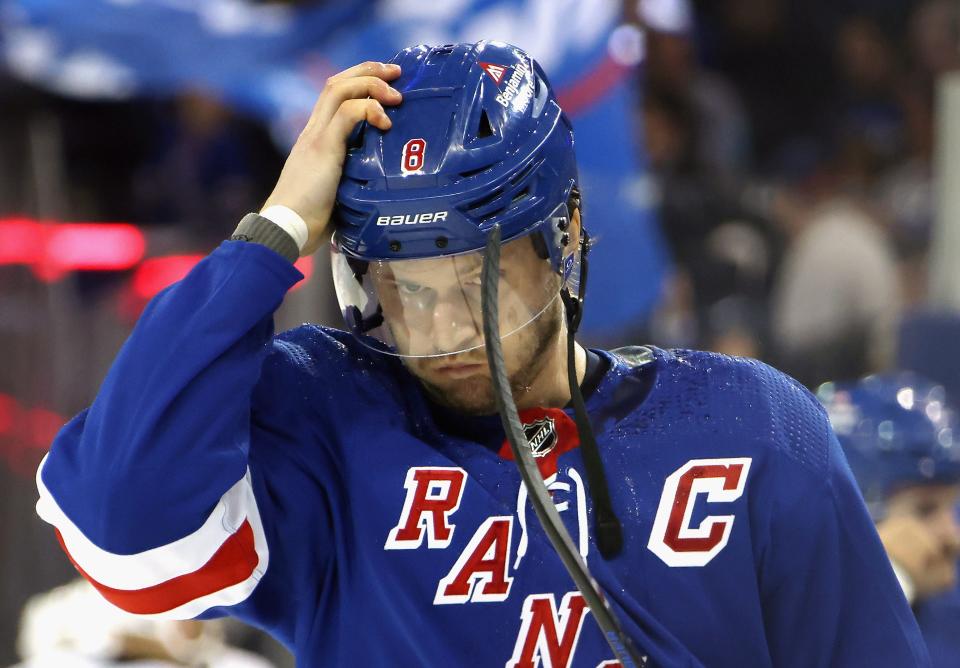 NEW YORK, NEW YORK - APRIL 01: Jacob Trouba #8 of the New York Rangers adjusts his helmet prior to the game against the Pittsburgh Penguins at Madison Square Garden on April 01, 2024 in New York City.