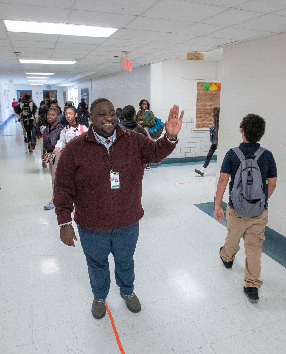 Principal Paul Lovely greets students as they change classes at Bellview Middle School in Pensacola on Monday, Dec. 18, 2023. The school will become the third school in Escambia County to adopt the Community Partnership Schools model.
