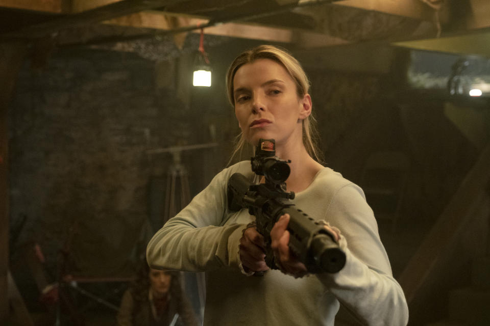 This image released by Universal Pictures shows Betty Gilpin in a scene from "The Hunt." (Patti Perret/Universal Pictures via AP)