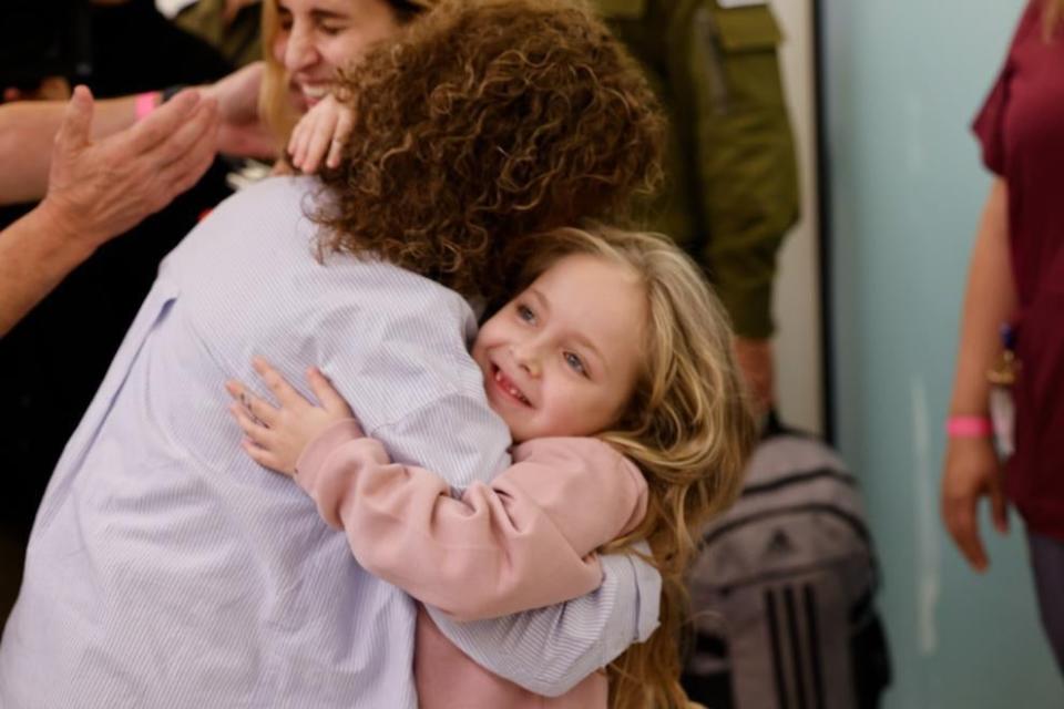 Amelia Aloni, 6, hugs her grandmother for the first time after being released from Gaza (Schneider Children's Medical Center Spokesperson. Photo courtesy of the family)