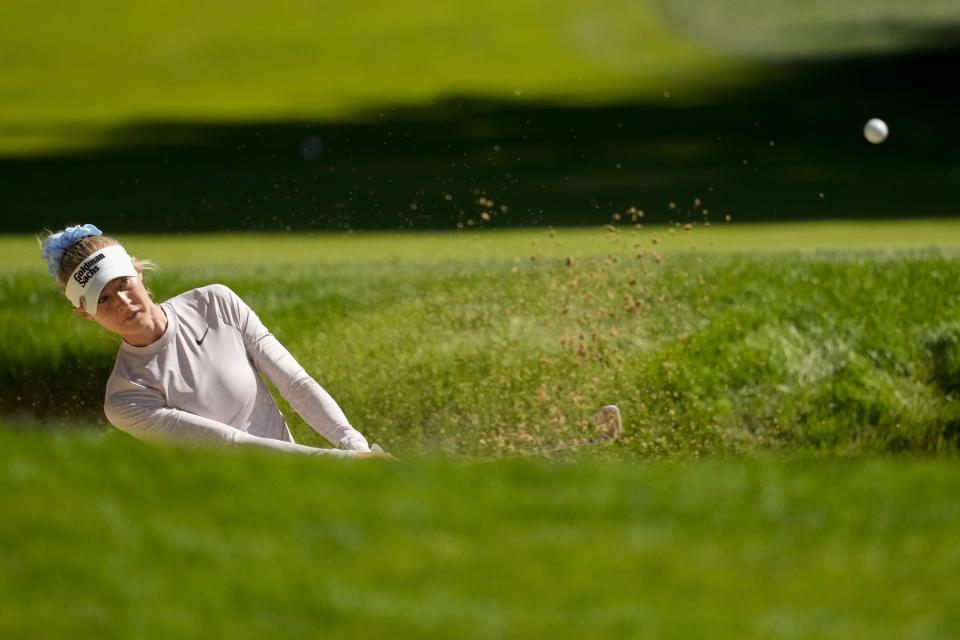 Nelly Korda hits out of a bunker at the 18th hole during a practice round for the Womens PGA Championship golf tournament at Sahalee Country Club, Wednesday, June 19, 2024, in Sammamish, Wash. (AP Photo/Lindsey Wasson)