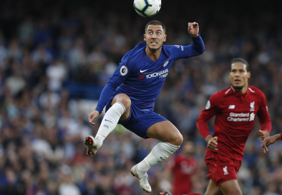 Chelsea’s Eden Hazard heads the ball during the English Premier League soccer match between Chelsea and Liverpool at Stamford Bridge stadium in London, Saturday, Sept. 29, 2018. (AP Photo/Frank Augstein)