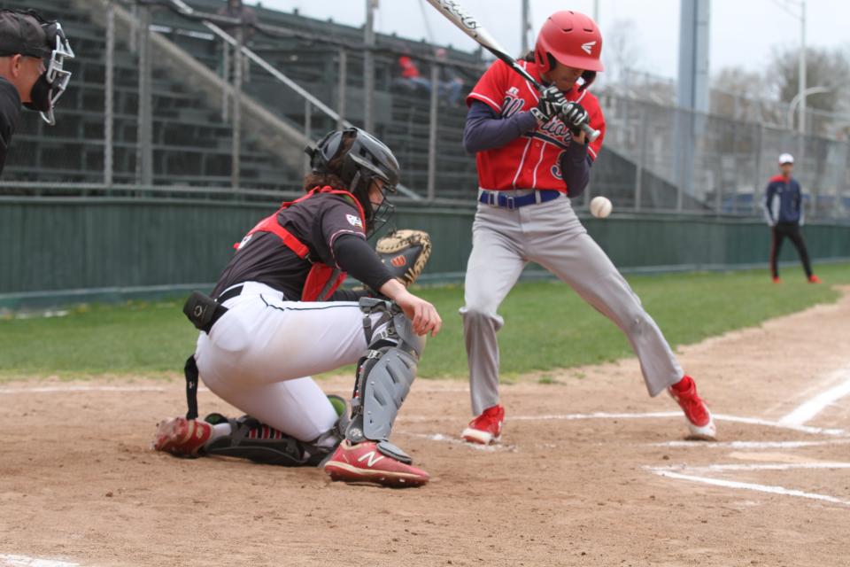 Rogers High catcher Nixon Brownell couldn't catch this pitch because the ball hit Central Falls batter Johan Medina. Brownell did his hiting damage at the plate against Hope on Saturday as he had two triples, a double, single and seven RBIs.