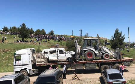 Damaged vehicles that belonged to Kurdish fighters from the People's Protection Units (YPG) are transported from their headquarters after it was hit by Turkish airstrikes in Mount Karachok near Malikiya, Syria April 25, 2017. REUTERS/Rodi Said