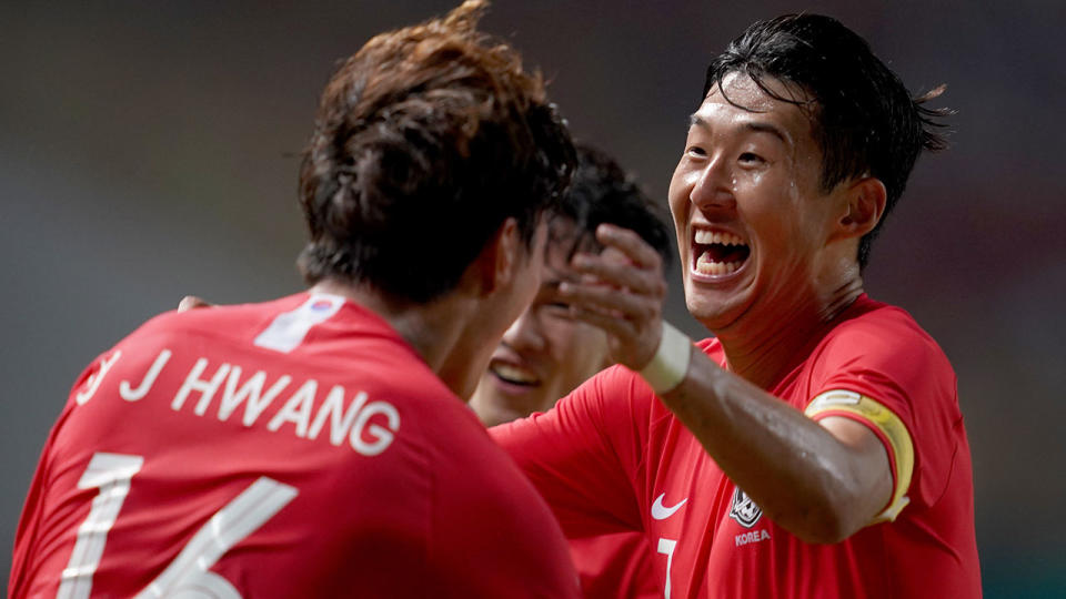 Son celebrates with his South Korean teammates at the Asian Games. Pic: Getty