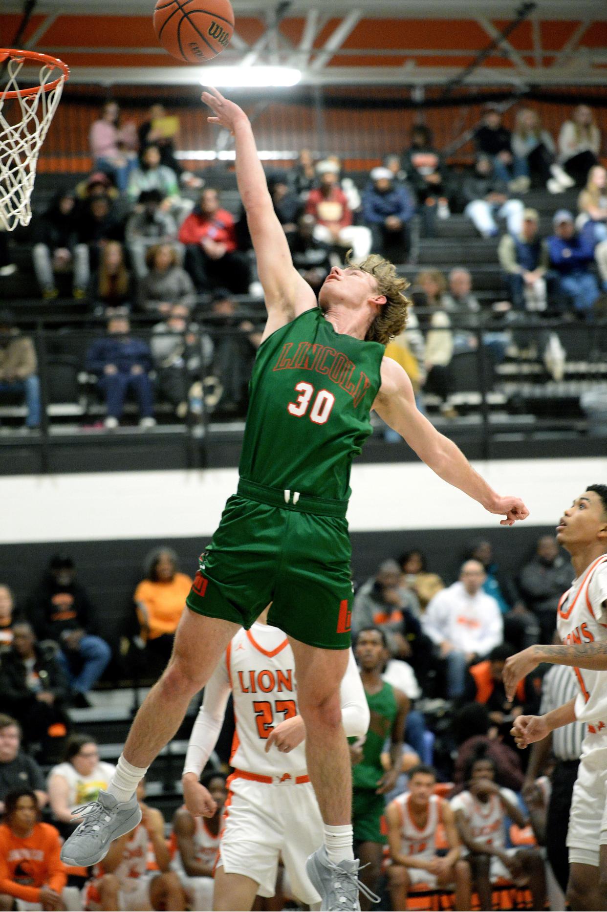 Lincoln's Drew Hayes goes up for a basket during the game against Lanphier Friday, January 12, 2024.