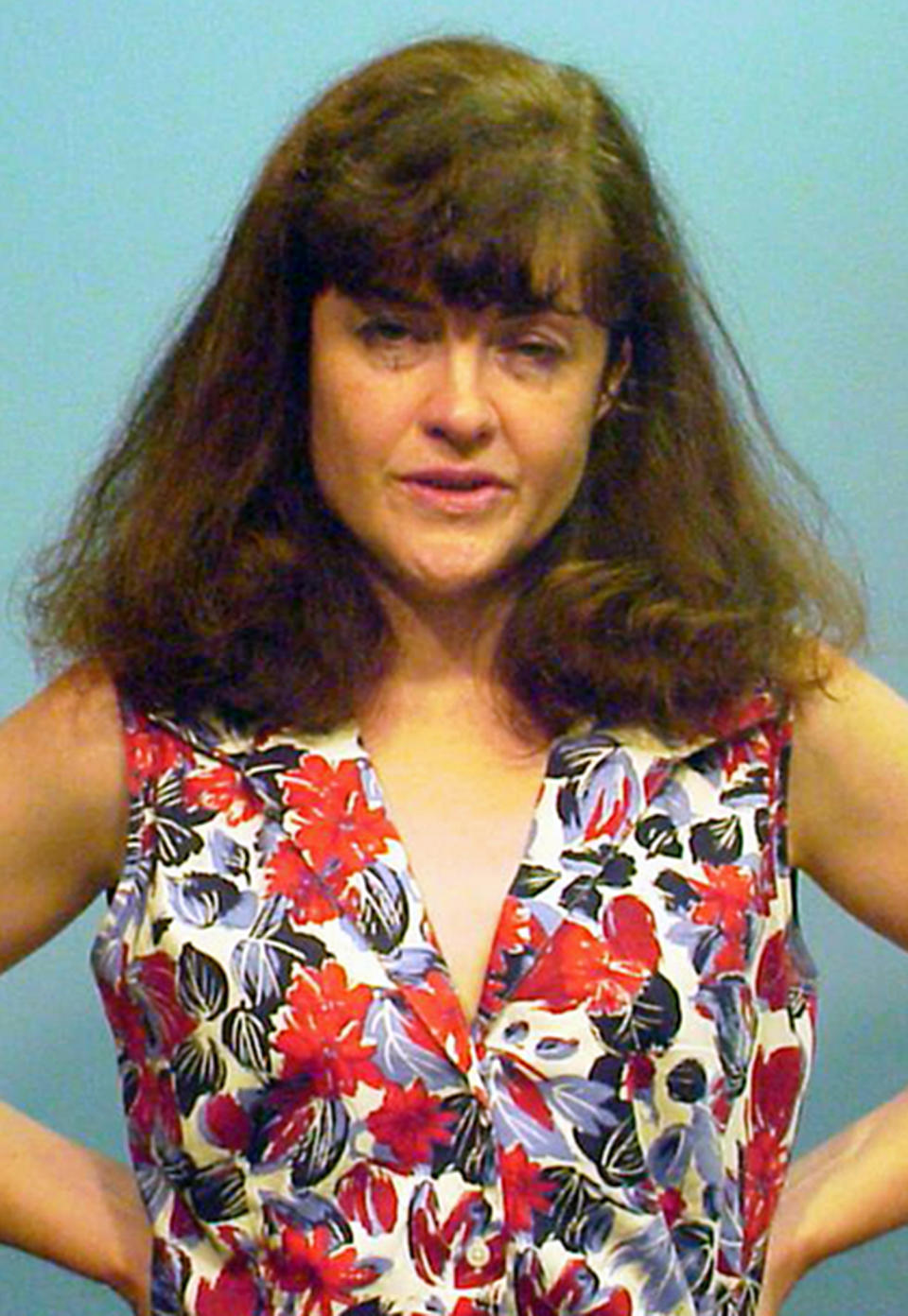 This booking photo provided by the Chicago Police Department shows Kathleen Kearney, 44, of Canton, Mass. Kearney appeared in a Cook County courtroom, Tuesday, July 17, in Chicago, where she was charged with two felony counts of stalking Chicago Cubs President Theo Epstein after she was arrested on Monday trying to deliver a birthday present to his young son at his Chicago home. Prosecutors say Kearney had tried to contact Epstein several times when he was the general manager of the Boston Red Sox. (AP Photo/Chicago Police Department)