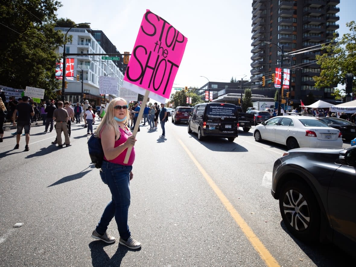 Demonstrators gather to protest COVID-19 restrictions outside Vancouver City Hall on Wednesday, Sept. 8, 2021. (Maggie MacPherson/CBC - image credit)