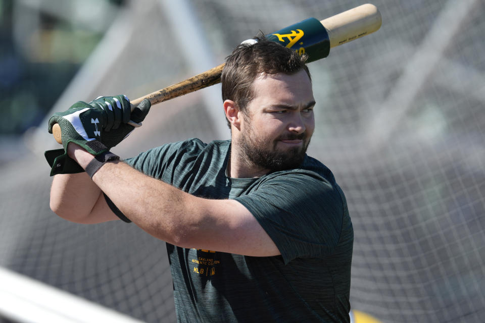 Oakland Athletics catcher Shea Langeliers hits during a baseball spring training workout, Friday, Feb. 16, 2024, in Mesa, Ariz. (AP Photo/Matt York)