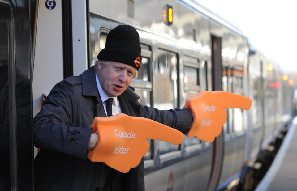London Mayor Boris Johnson boards one of the first trains of the new London Overground extension connecting Clapham Junction with Canada Water. ASSOCIATION Photo. Picture date: Monday December 10 2012. The new service will be London's first new orbital Journey times from south and east London. See PA story RAIL Link. Photo credit should read: Stefan Rousseau/PA
