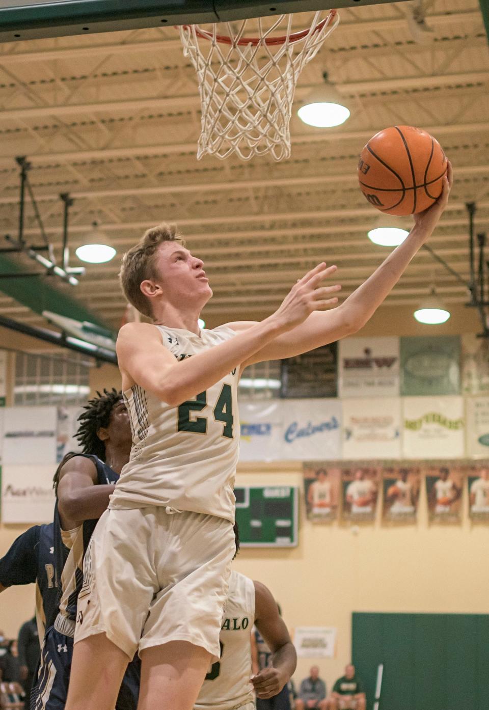 The Villages' Sam Walters scores during the Class 4A-District 5 championship game on Feb. 11 against Eustis at the Range in The Villages. Walters is the Daily Commercial Boys Basketball All-Area Player of the Year. [PAUL RYAN / CORRESPONDENT]