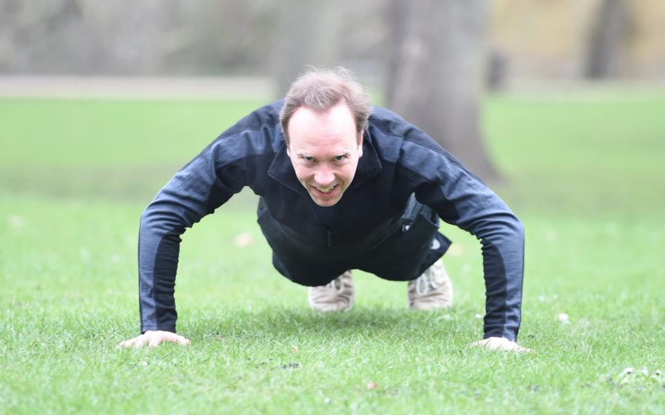 Matt Hancock banging out press-ups in a London park - Jeremy Selwyn/Eyevine