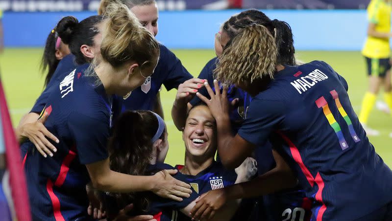 USA forward Carli Lloyd, center, is patted on the head as she is swarmed by her team mates after scoring a goal against Jamaica during the first half of their 2021 WNT Summer Series match Sunday, June 13, 2021, in Houston. 