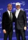 Laureus ambassadors, former heavyweight boxer Axel Schulz (R) and former Formula One racing driver David Coulthard, arrive for the Laureus Sports Awards in Kuala Lumpur March 26, 2014. REUTERS/Samsul Said (MALAYSIA - Tags: SPORT)