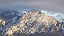 Snow covers the Wasatch Mountains, Wednesday, April 8, 2024, near Salt Lake City. Salt Lake City's enduring enthusiasm for hosting the Olympics was on display, when members of the International Olympic Committee came to Utah during a site visit ahead of a formal announcement expected this July to name Salt Lake City the host for the 2034 Winter Olympics. (AP Photo/Rick Bowmer)