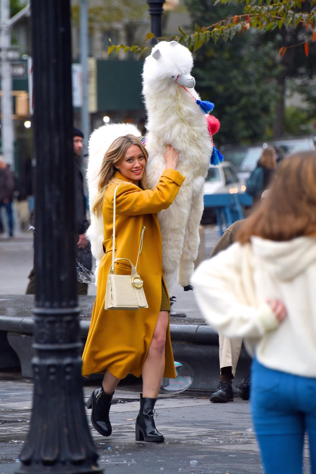 Hilary Duff is seen with a giant stuffed llama on the first day on set of the "Lizzie McGuire" revival at Washington Square Park on Oct. 29, 2019, in New York City.