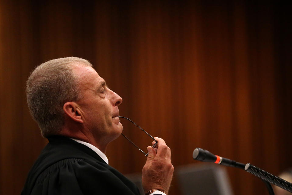 State prosecutor Gerrie Nel during cross-examination of Oscar Pistorius, in court in Pretoria, South Africa, Wednesday, April 9, 2014. Pistorius is charged with the murder of his girlfriend Reeva Steenkamp, on Valentines Day in 2013. The chief prosecutor in Oscar Pistorius’ murder trial on Wednesday urged the athlete to “take responsibility” for fatally shooting his girlfriend, telling him to look at a police photograph of a dead Reeva Steenkamp’s bloodied head that was displayed in court. (AP Photo/Siphiwe Sibeko, Pool)