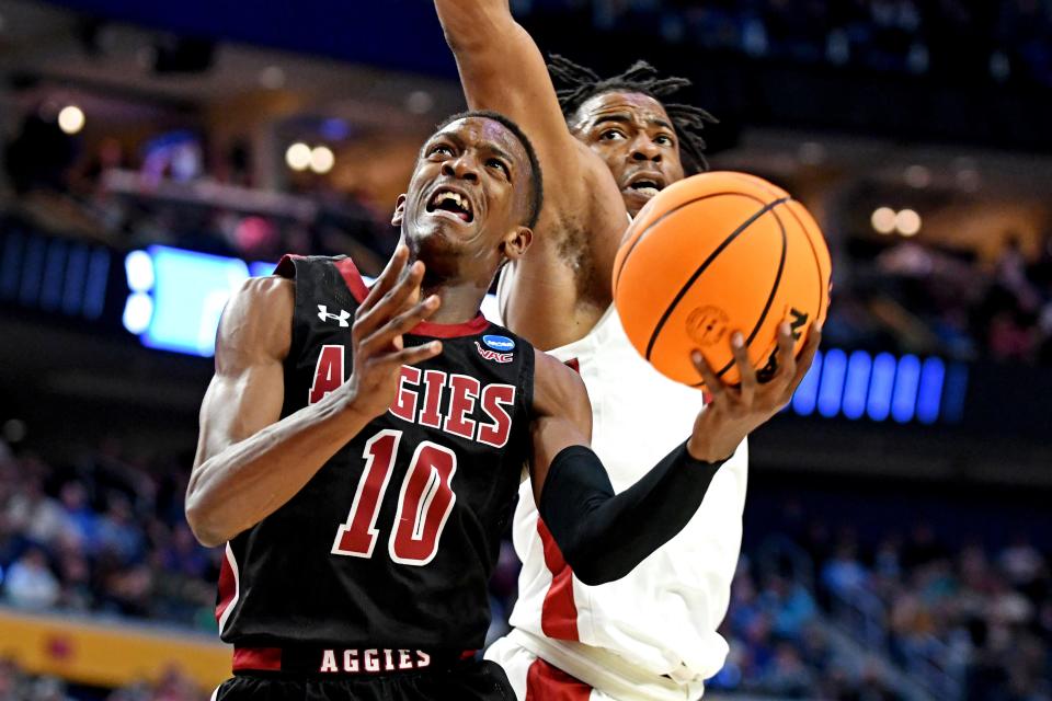 New Mexico State guard Jabari Rice goes for a shot against Arkansas in last year's NCAA Tournament. Rice started 74 career games for the Aggies before transferring this year to Texas, where he has become one of the most explosive sixth men in the country.