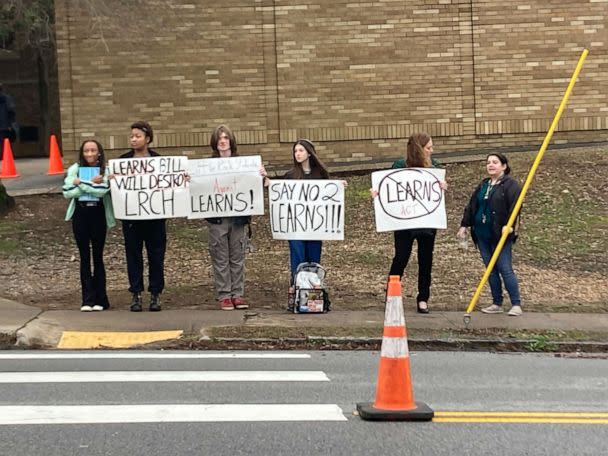 PHOTO: Students hold signs outside of Little Rock Central High School on Wednesday, March 1, 2023. (Ruthie Walls)