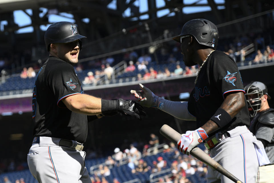 Miami Marlins' Jake Burger, left, celebrates his home run with Jazz Chisholm Jr., right, during the first inning of a baseball game against the Washington Nationals, Saturday, Sept. 2, 2023, in Washington. (AP Photo/Nick Wass)