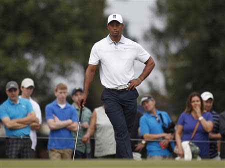 Tiger Woods of the U.S. waits on the eighth green during the third round of the Tour Championship golf tournament at East Lake Golf Club in Atlanta, Georgia September 21, 2013. REUTERS/Tami Chappell