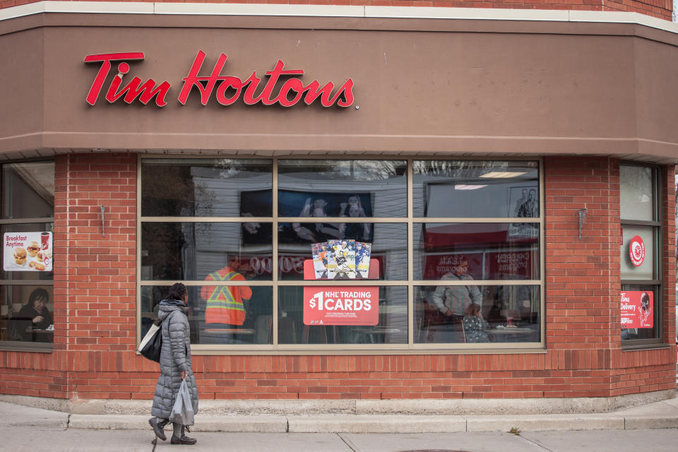 Picture of a sign with the logo of Tim Hortons on their main cafe for North Ottawa, Canada. Tim Horton's is a multinational fast food restaurant known for its coffee and donuts. It is also Canada's largest quick service restaurant chain