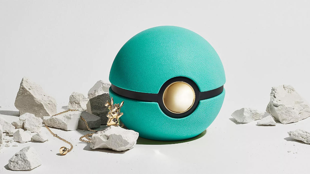  Tiffany & Co. jewellery collection featuring a gold Pikachu pendant and Poké Ball box. 