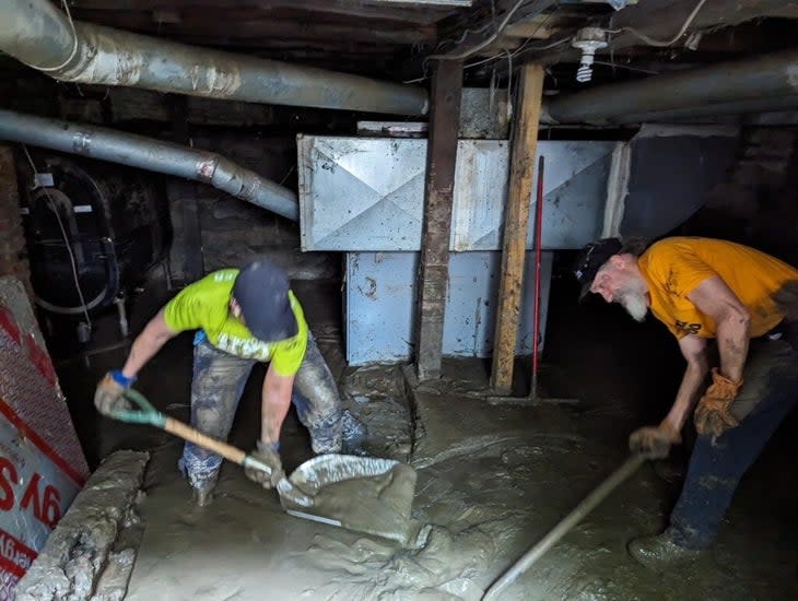 Vermont 100 volunteers mucking out a basement