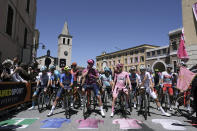 Lucas Plapp of Team Jayco Alula, foreground right, Lilian Calmejane, of Team Intermarche' – Wanty, foreground left, Jonathan Milan, of Team Lidl - Treck, centre, and Tadej Pogacar of Team UAE Emirates, second right, line up at the start of the stage 8 of the Giro d'Italia, Tour of Italy cycling race, from Spoleto to Prati di Tivo, Italy, Saturday, May 11, 2024. (Massimo Paolone/LaPresse via AP)
