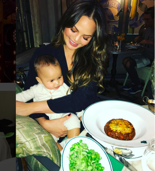 chrissy teigen and luna at restaurant