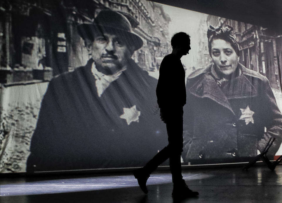 An actor of the Romania's Jewish State Theatre rehearse the musical drama "The Lights of the Ghetto" a mix of music and stories by Holocaust survivors in Bucharest, Romania, Saturday, Jan. 26, 2019, a day before the premiere on International Holocaust Remembrance Day. About 280,000 Romanian Jews and 11,000 Romanian Roma, or Gypsies, were deported and killed during WWII when Romania was ruled by a pro-nazi regime. (AP Photo/Vadim Ghirda)