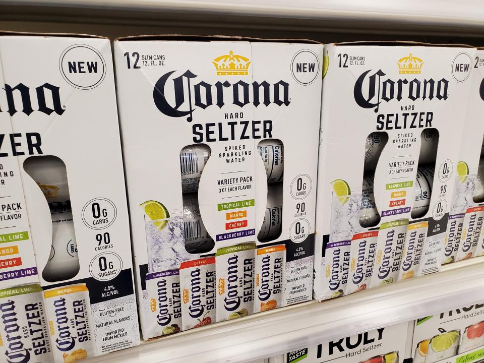 Close-up of packages of Corona brand hard seltzer, an alcoholic seltzer water drink, on store shelves in San Ramon, California, July, 2020. (Photo by Smith Collection/Gado/Getty Images)