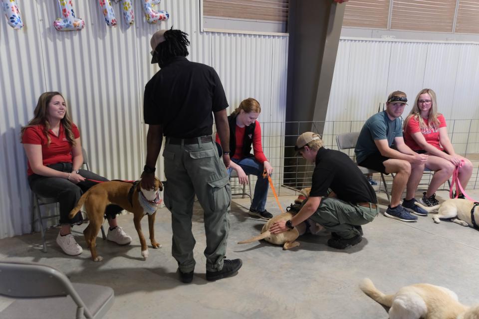 Prospective owners have a meet and greet with dogs at the Texas Tech School of Veterinary Medicine "Barks and Recreation" event Saturday at Mariposa Station in west Amarillo.