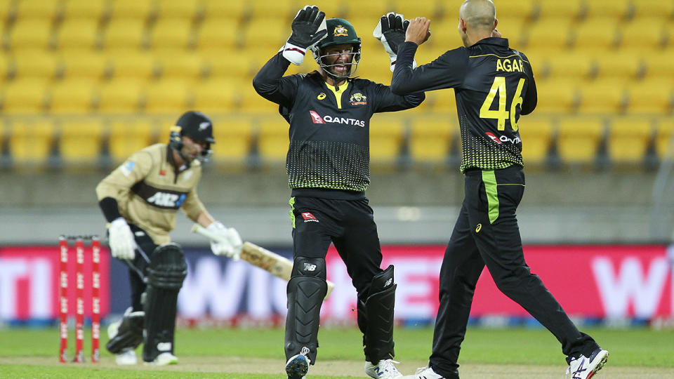 Matthew Wade and Ashton Agar, pictured here celebrating the wicket of Devon Conway.