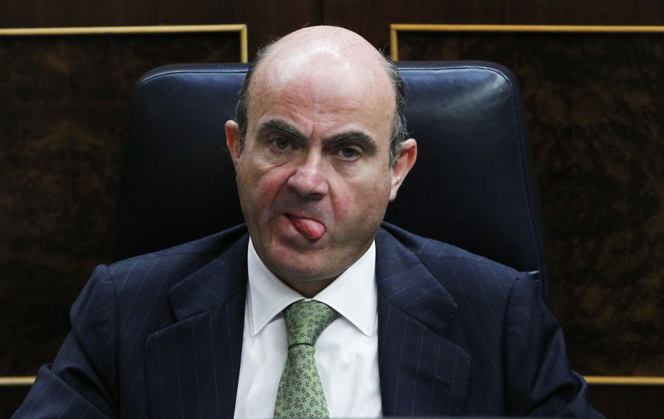 Spain's Economy Minister Luis De Guindos looks on during Spain's Prime Minister Mariano Rajoy's speech during a control session at the Spanish Parliament, in Madrid, Spain, Wednesday, July 11, 2012. Spain has announced a euro 65 billion austerity package that includes tax hikes and spending cuts a day after winning approval from euro zone partners for a huge bailout of Spain’s banks. (AP Photo/Andres Kudacki)