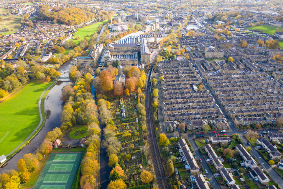 Aerial photo taken in the small town of Shipley in the City of Bradford, West Yorkshire, England showing the autumn fall colours of the hosing estates and roads in the town centre.