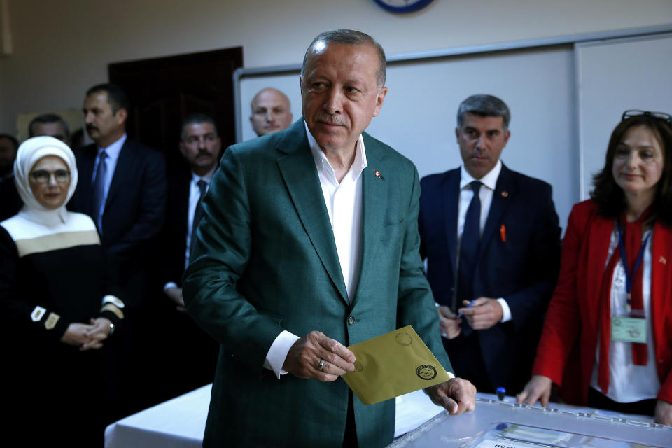 Turkey's President Recep Tayyip Erdogan, casts his ballot during the local elections, in Istanbul, Sunday, March 31, 2019. Mayoral elections are underway in 30 large cities in Turkey along with other municipal races Sunday that are seen as a barometer of President Recep Tayyip Erdogan's popularity amid a sharp economic downturn in the nation straddling Europe and Asia. (AP Photo/Lefteris Pitarakis)