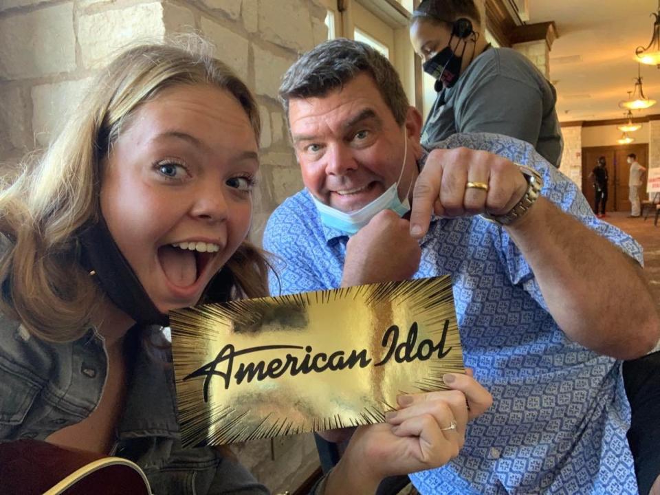 In Austin, Carrie Brockwell takes a selfie with her American Idol golden ticket and father Barry Brockwell.