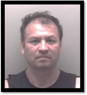 This image provided by the Richmond Va., police department shows Julio Alvardo-Dubon, 52, of Richmond, who was arrested in connection with an investigation related to a planned mass shooting on July 4th in Richmond, Va. Police said that they thwarted a planned July 4 mass shooting after receiving a tip that led to arrests and the seizure of multiple guns — an announcement that came just two days after a deadly mass shooting on the holiday in a Chicago suburb. (Richmond Police Department via AP)